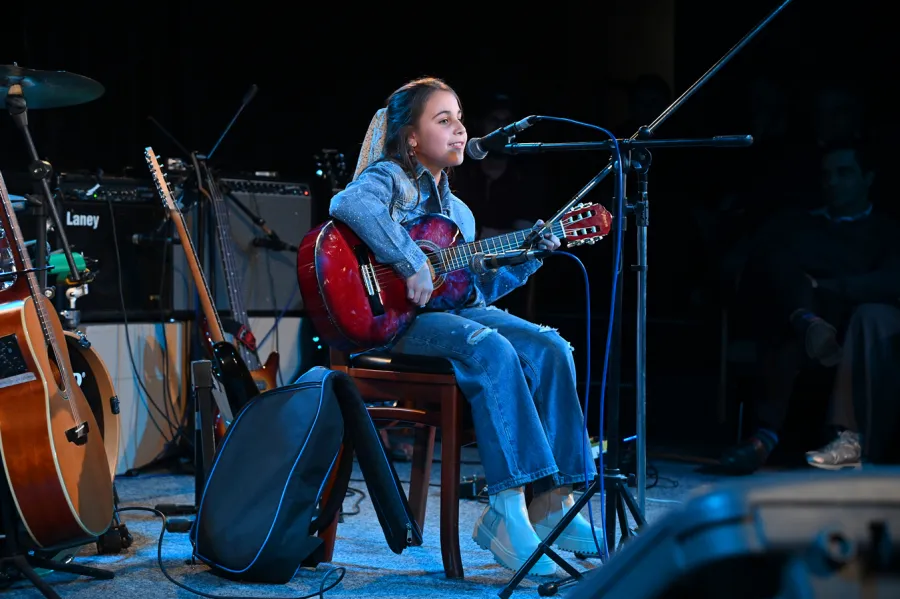 Músicos durante un ensamble de bandas en el Club